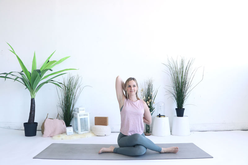 Try Cow Face Pose for your Travel Yoga Sequence